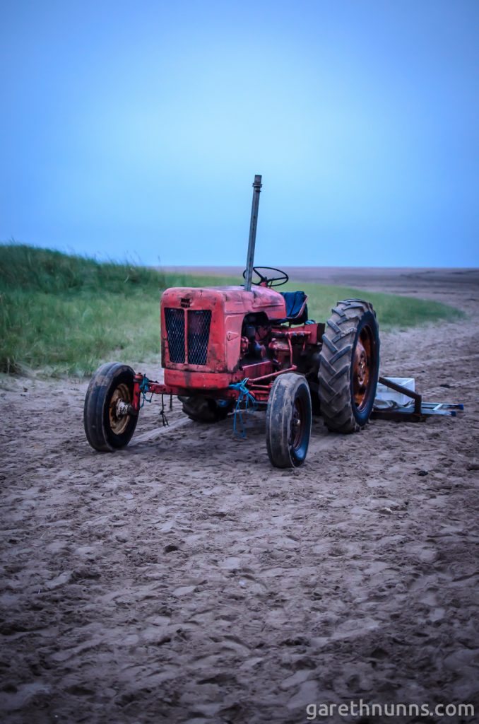 Tractor on the beach in Northumberland